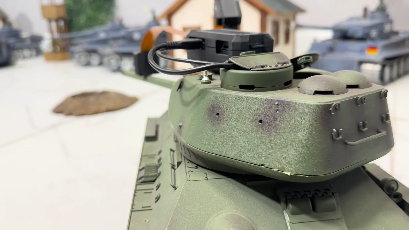 Onboard camera mounted above the barrel of a physical 1:16 tank